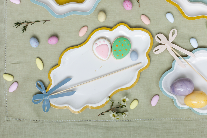 White scalloped mini trays with pastel speckled patterns and blue yellow pink rims
