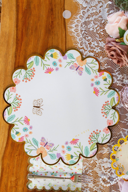 Floral scalloped paper placemat, round shape with butterflies and blooming flowers