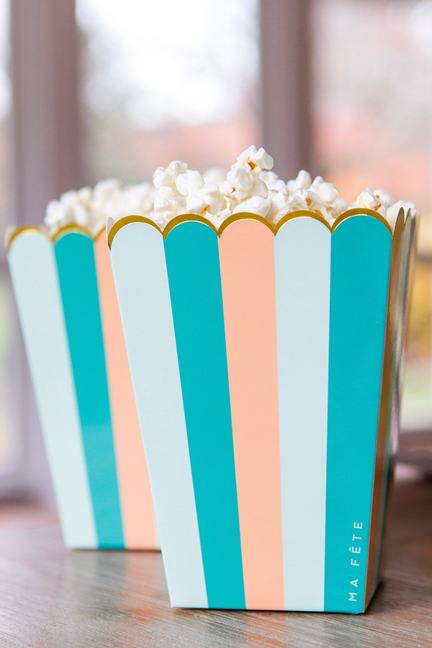 Fun fair treat holder, teal/peach/green stripes, filled with white popcorn