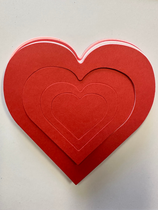 Large tri-color layered heart cut-out in red with curved white-pink trim
