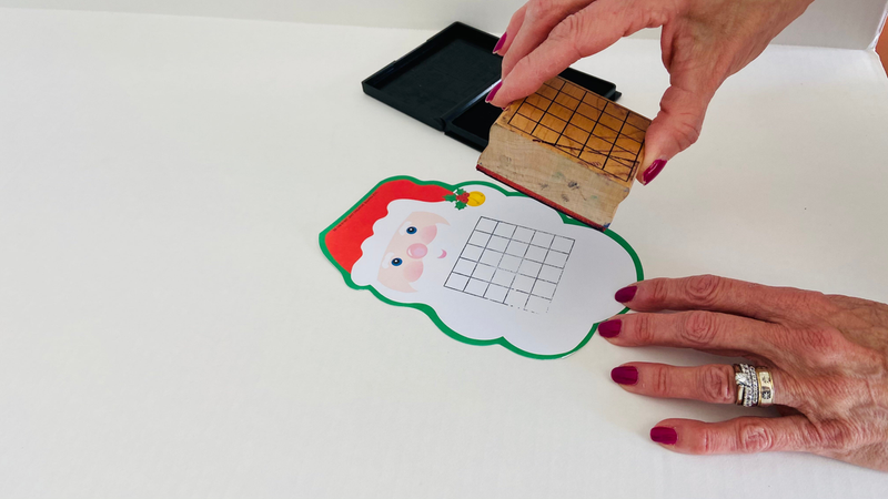 Jumbo 5-day grid stamp creating stamped squares on cloud-shaped card