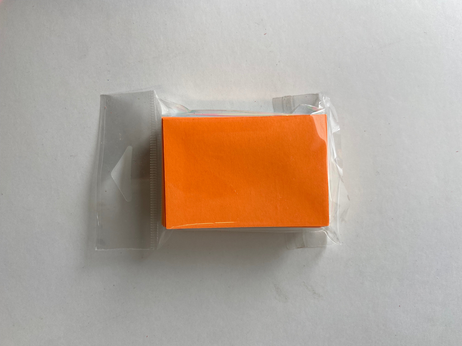 Orange blank index card sheets, 2x3 inches, in a clear plastic sleeve