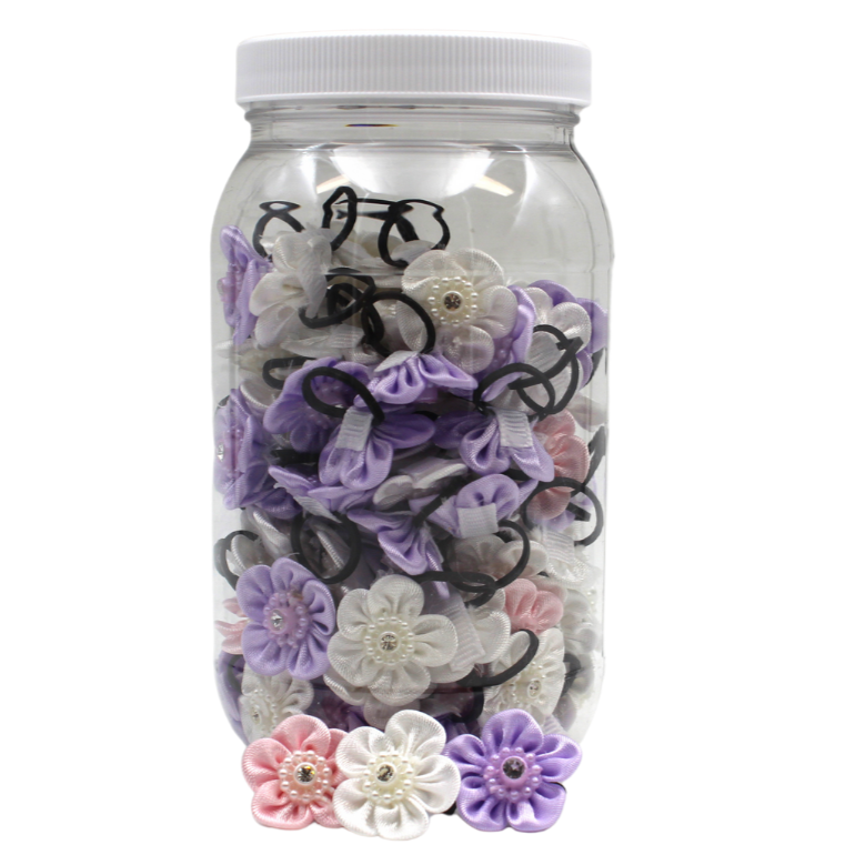 Pet flower bows in clear jar with purple, white, and pink flowers and black ties