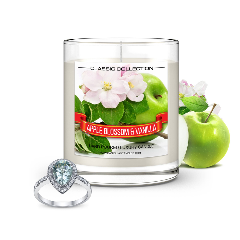 Clear glass luxury candle jar with floral apple label and silver heart-shaped ring