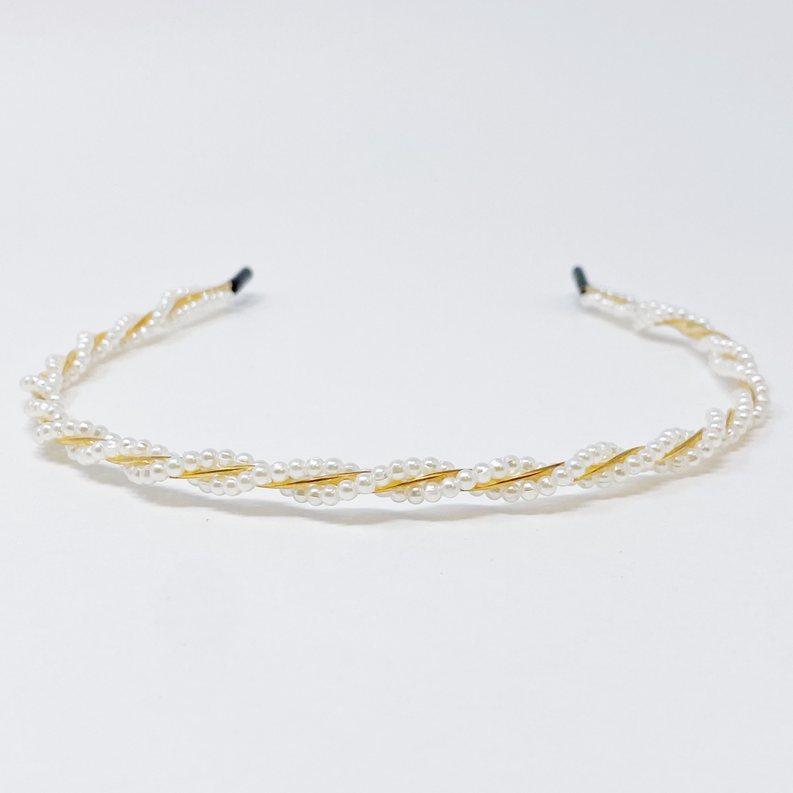 Pearl headband with gold-tone base and white beaded strands, wide curved design