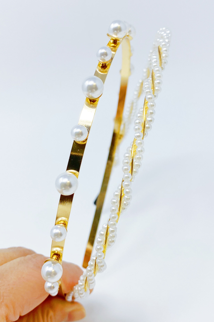 Pearl headband close-up with gold bar accents, round white pearls, and layered bead strand