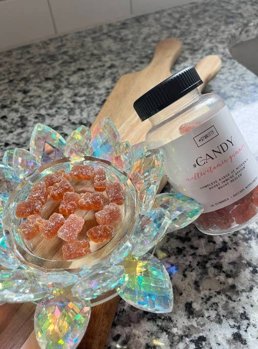 #CANDY multivitamin gummies jar with orange gummy pieces, glass bowl
