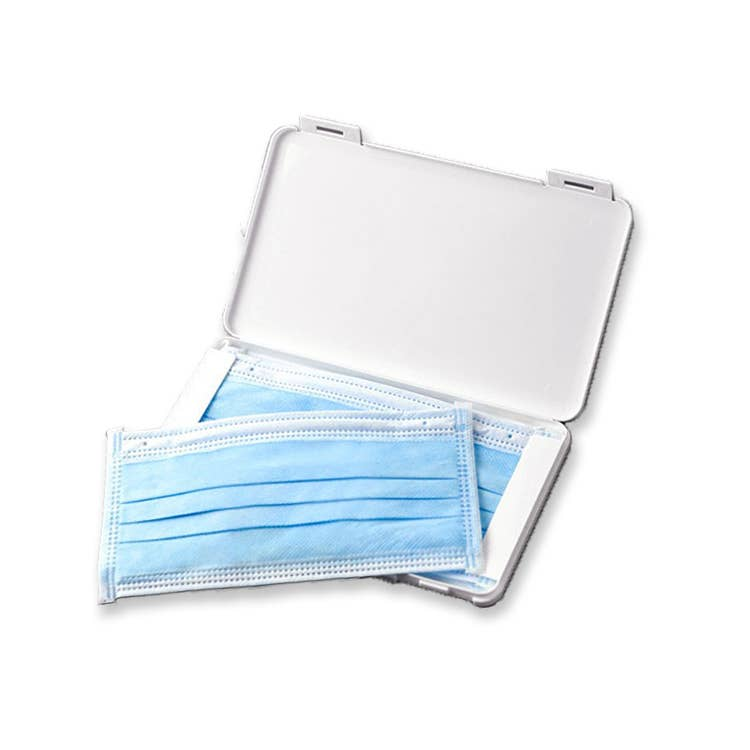 Face mask storage case with white lid open, storing multiple blue masks.