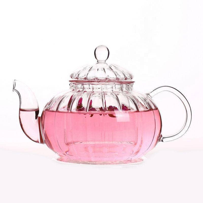 Pink-tinted glass teapot with lid and side handles, 20 oz.