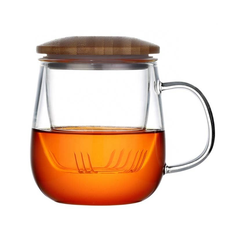 Glass teacup with infuser and bamboo lid, clear glass with amber tea and handle