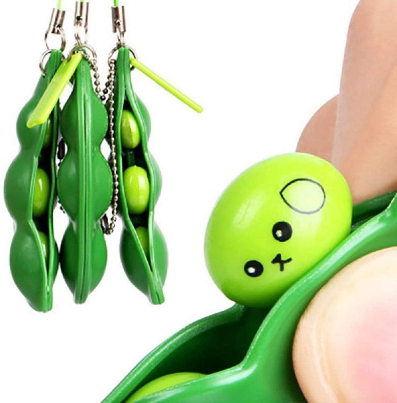 Green pea-pod fidget keychain with snap beads and small spinners, handheld