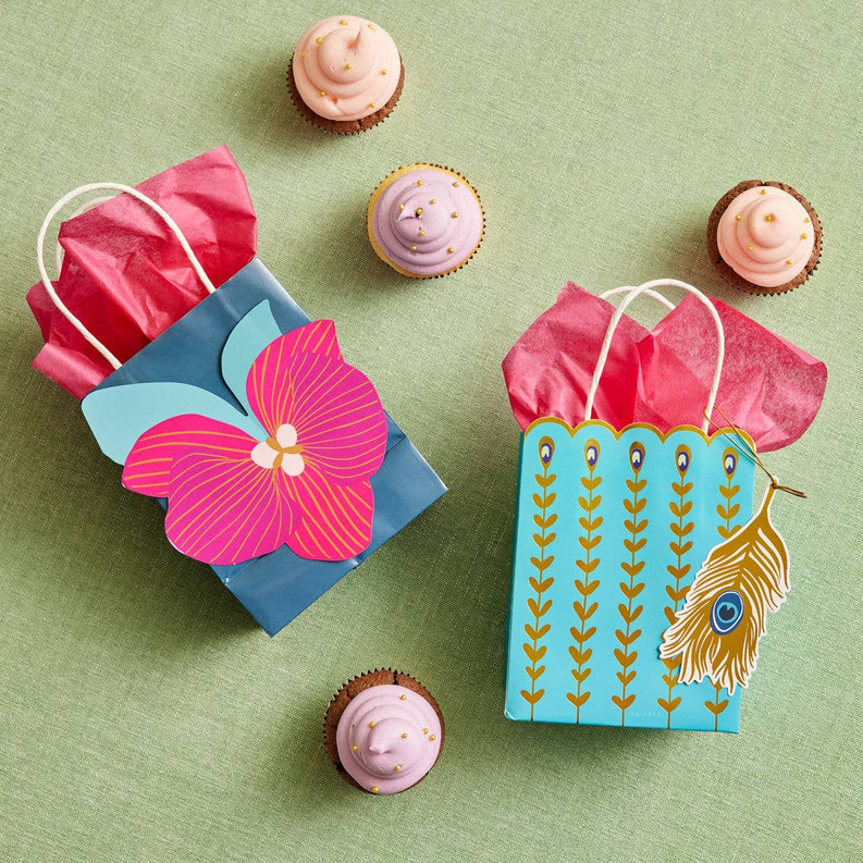 Tropical feather gift bags, teal with pink crinkle paper and white rope handles