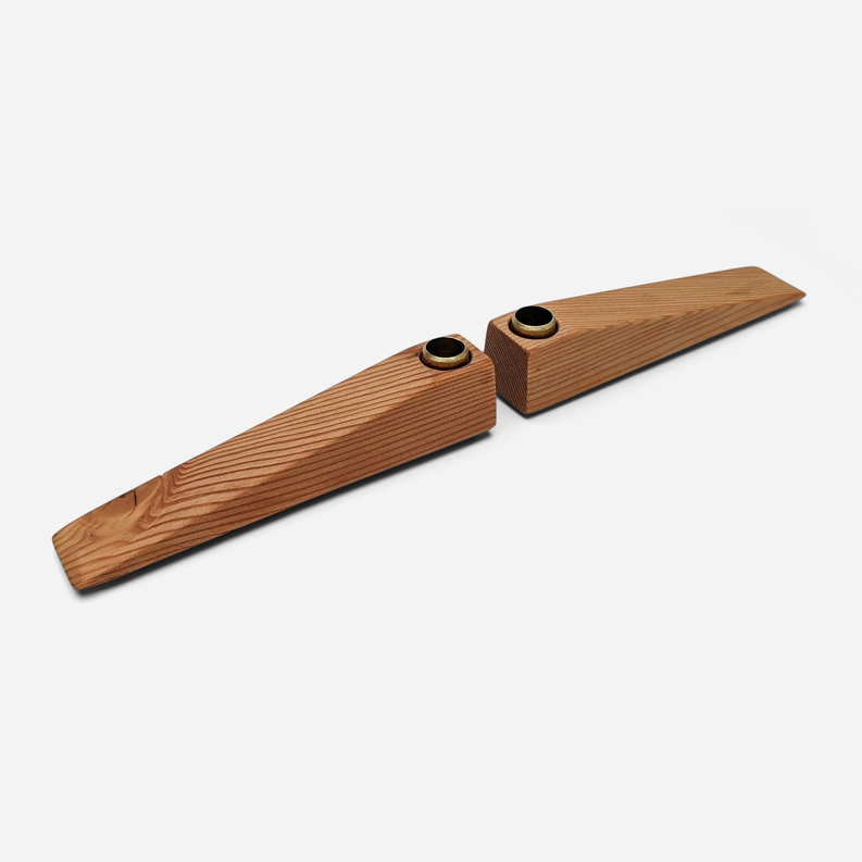 Wooden candle holder with two votive openings on a long split base, side view