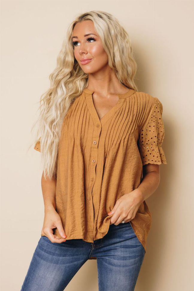 Camel brown pleated blouse with V-neck buttons and short sleeves with eyelet cuffs