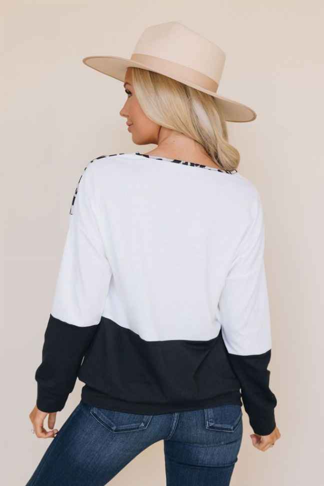 Leopard print color-block top, white back with black lower panel and long sleeves