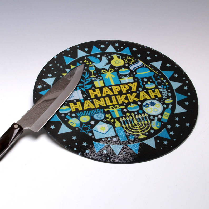 Hanukkah themed round cutting board with Happy Hanukkah graphic and attached knife