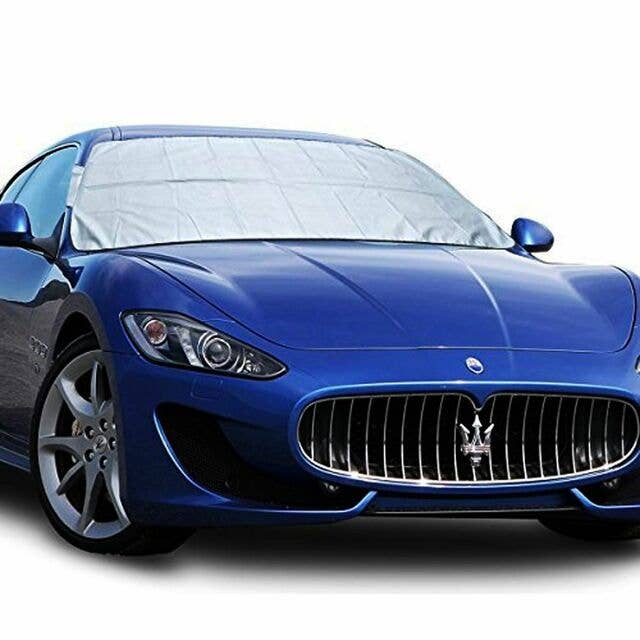 Reversible car windshield protector, light gray cover on blue car windshield
