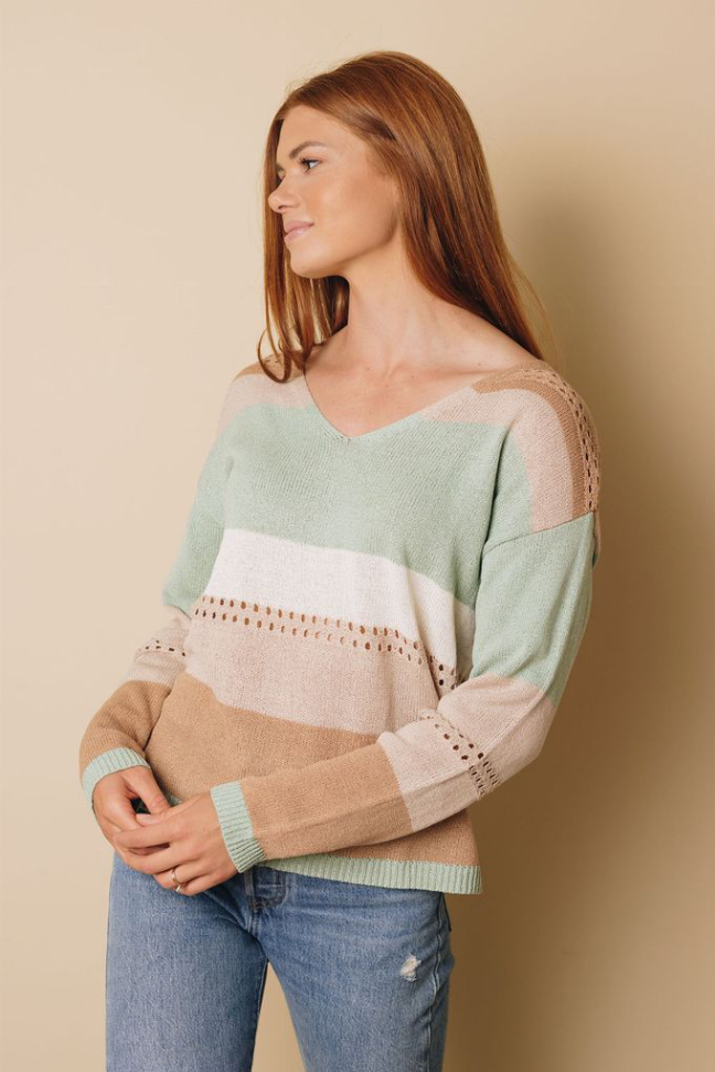 Knitted color block sweater, front view with V-neck and striped mint, cream, tan