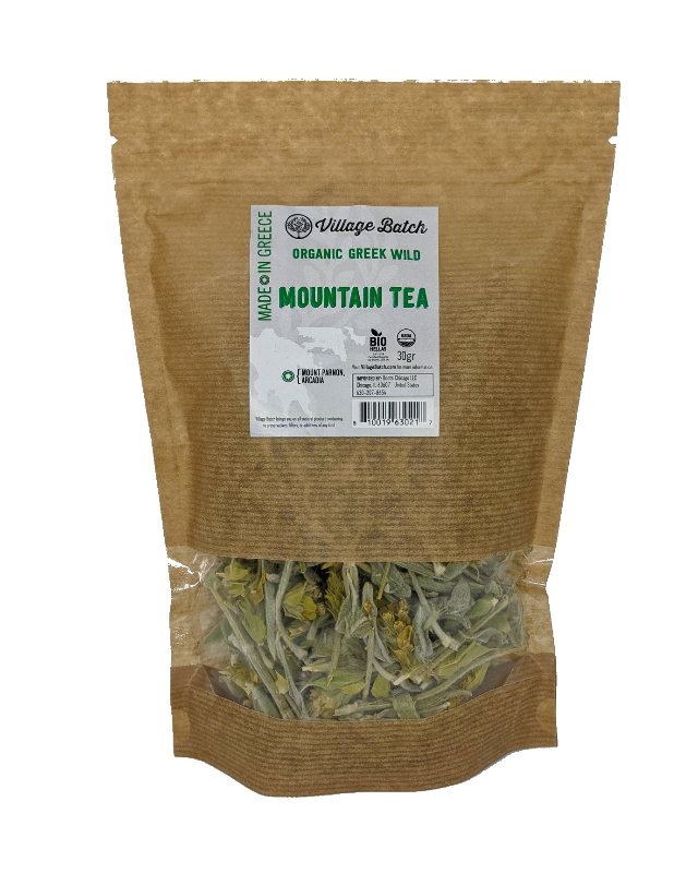 Organic green mountain tea pouch, kraft paper with label and dried leaf tea