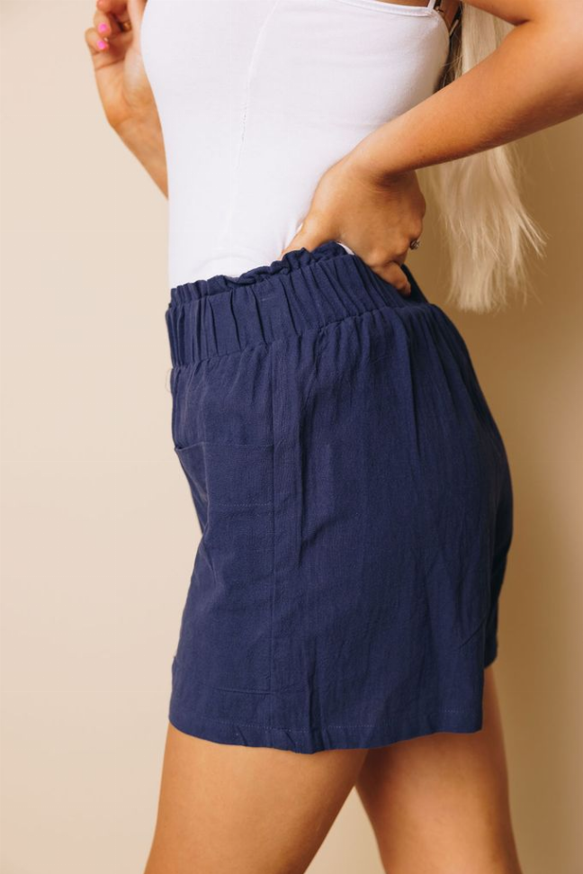 Navy casual shorts with elastic waistband and front pockets, relaxed fit
