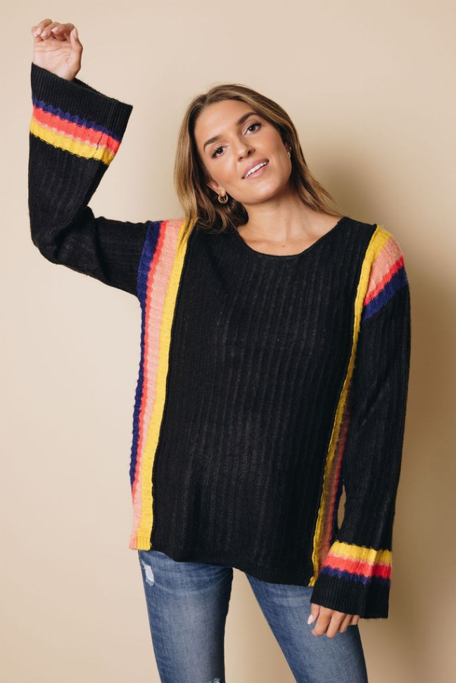 Black knit sweater with rainbow-striped cuffs and side panels, crew neck