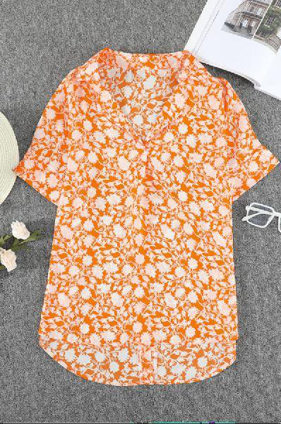 Orange floral print V-neck blouse with drape front and short sleeves