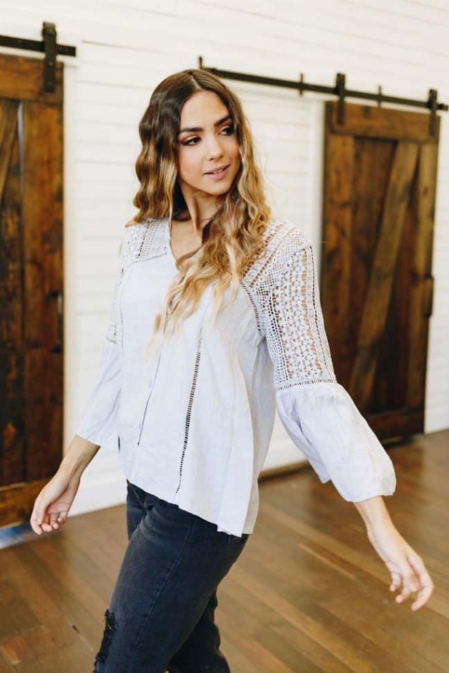 White crochet yoke boho top with V-neckline and three-quarter sleeves