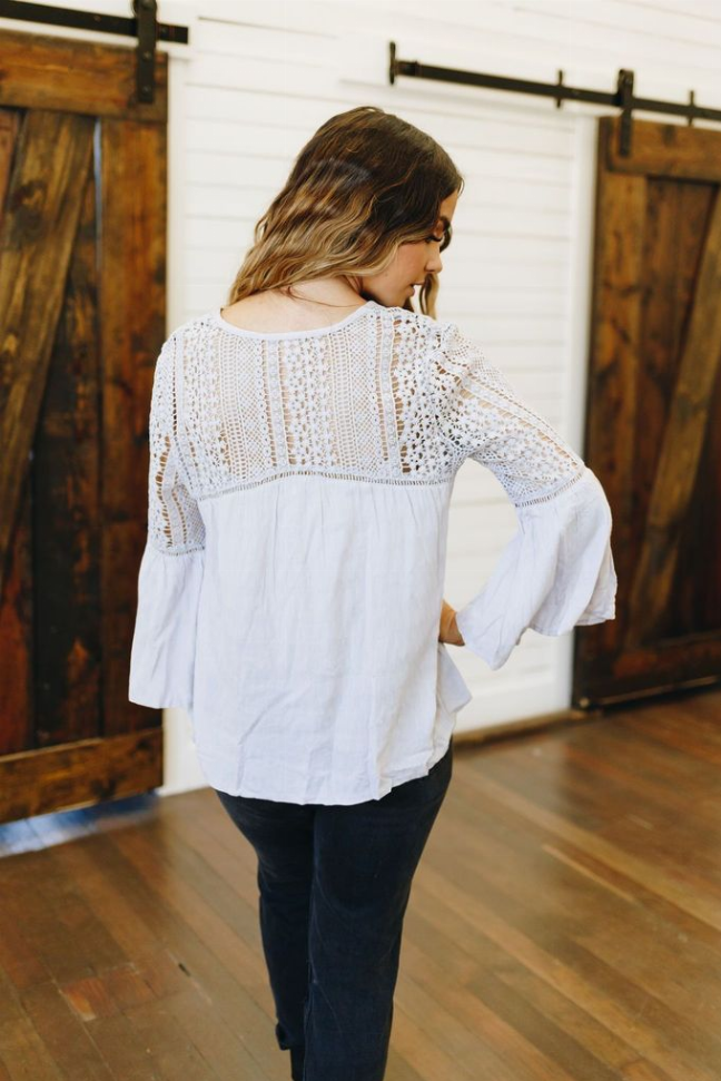 White boho crochet top, back view with openwork yoke and three-quarter sleeves