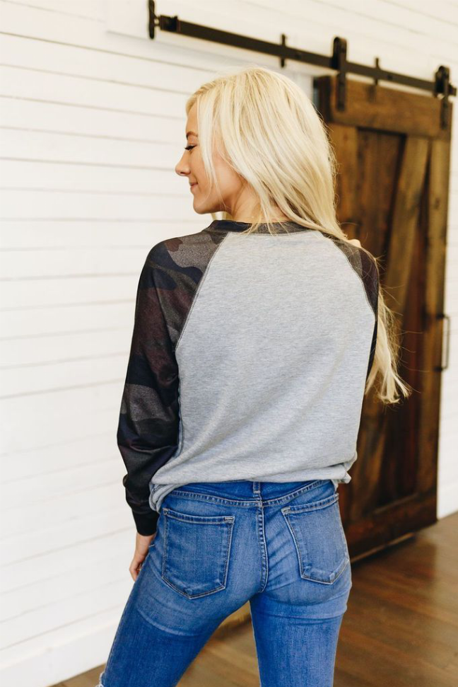Crewneck pullover back view, heather gray body with dark camo raglan sleeves