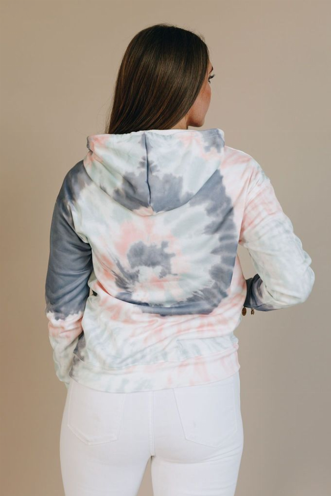 Tie-dye hoodie back view with hood and kangaroo pocket; blue and coral swirls on white