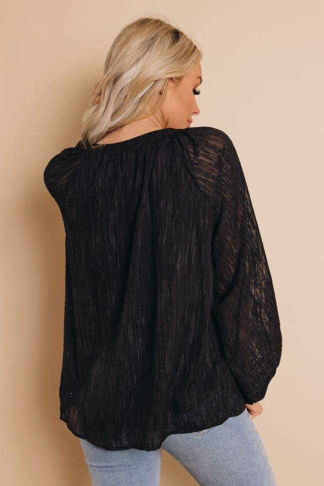 Black V-neck blouse top back view with long sleeves and textured fabric