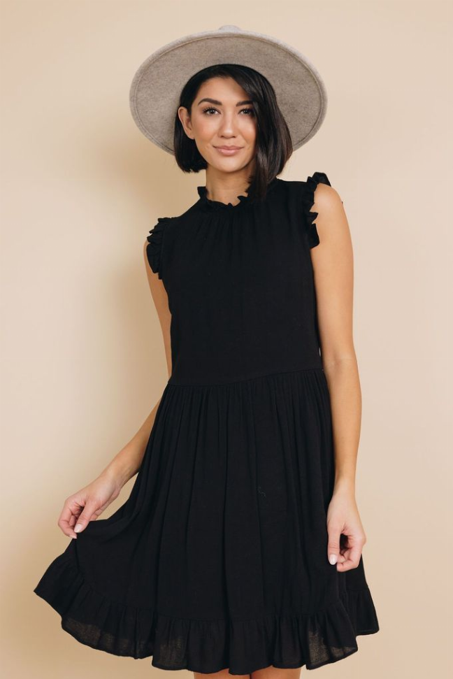 Black sleeveless ruffle dress with gathered waist and flared tiered skirt