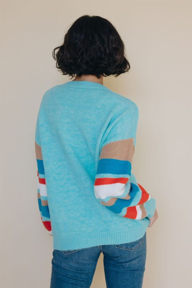 Light blue crewneck striped sweater with multicolor stripe sleeves, back view