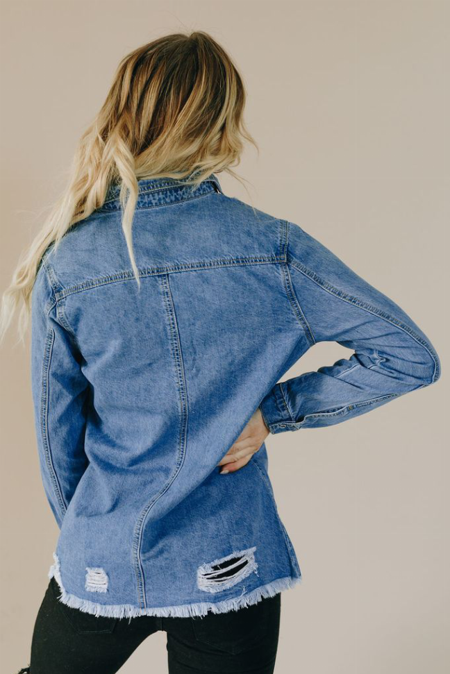 Light blue distressed denim button-up top, long sleeves, frayed hem; back yoke seam