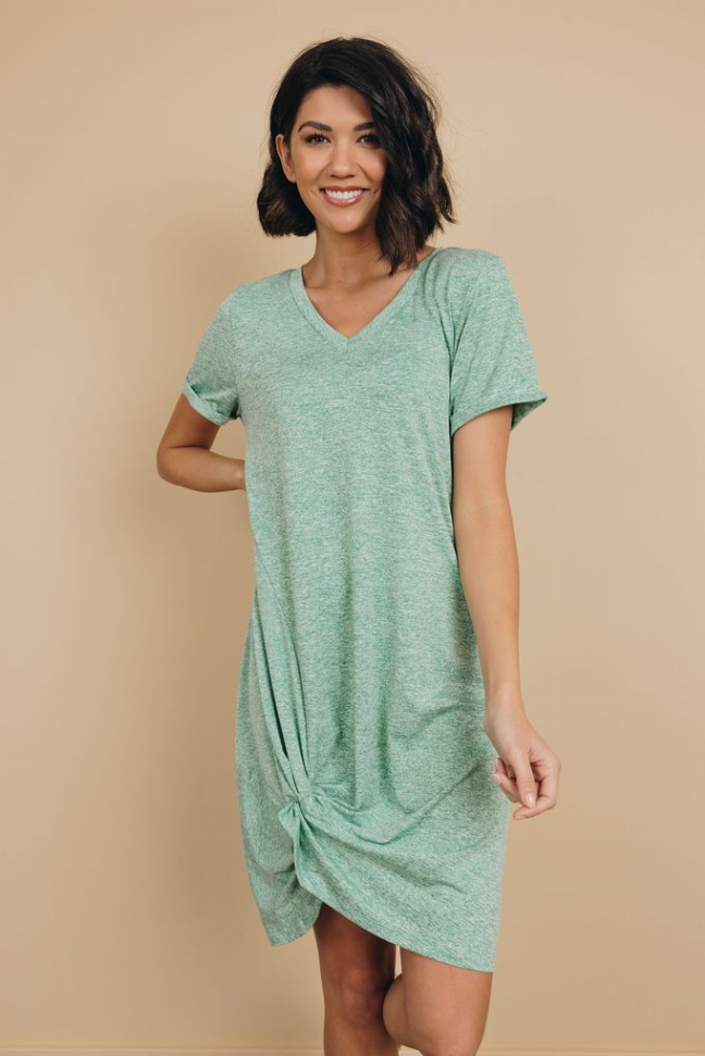 Mint green knotted mini dress with V-neck and short sleeves, draped knot detail at hem.