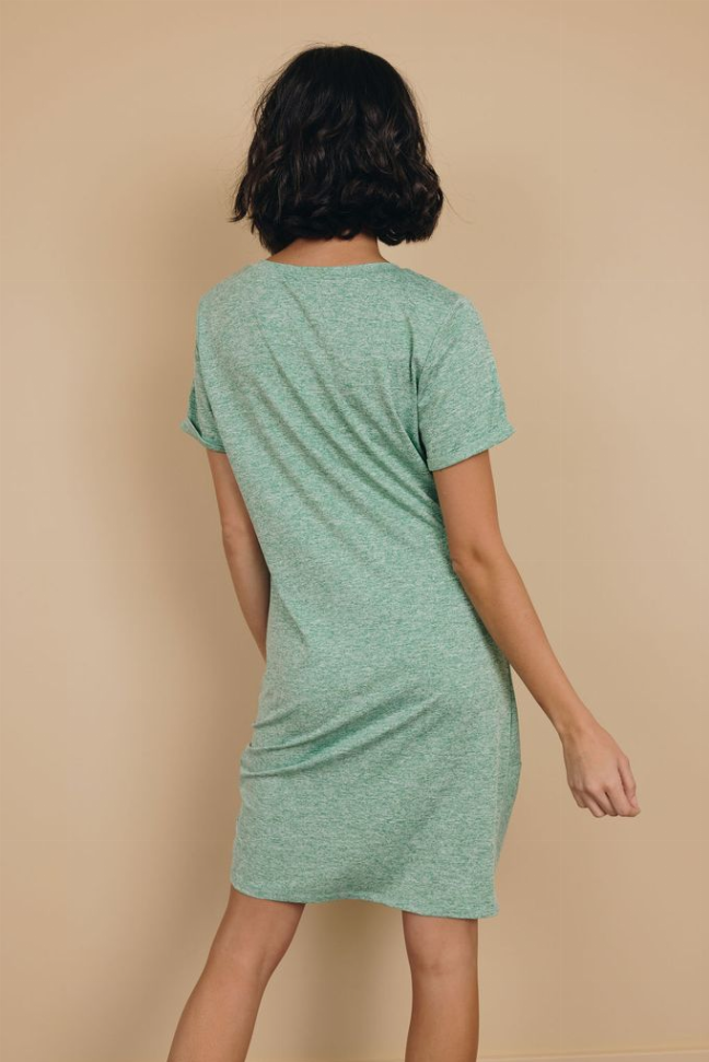 Mint green knotted mini dress with short sleeves and draped knot at back hem.