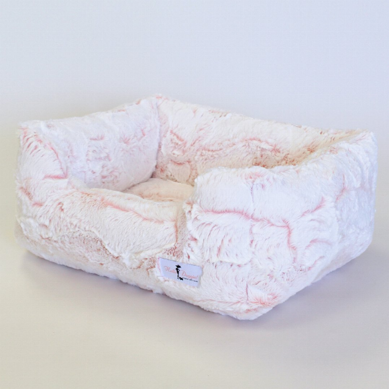 Rectangular plush dog bed, white with pink pattern, thick inner cushion and bolstered rim.