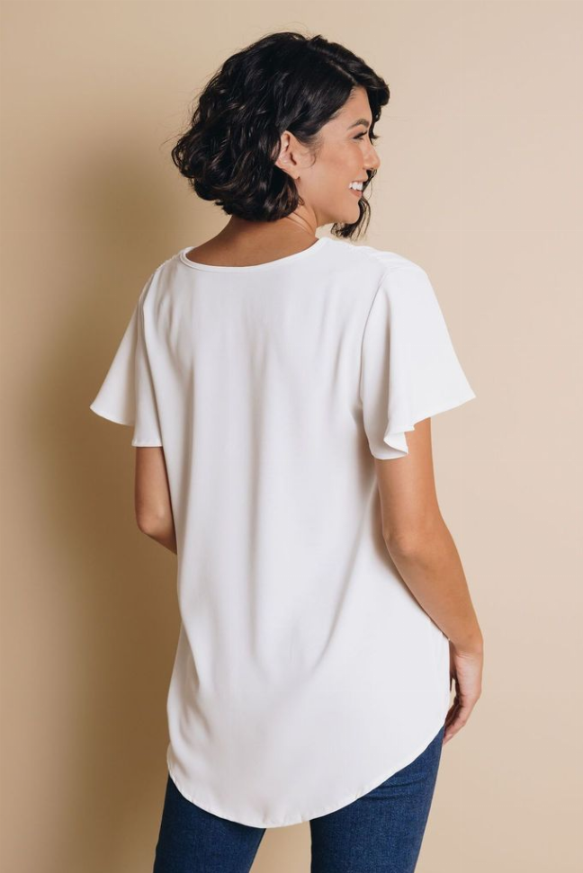 White short-sleeve top with crew neckline, back view