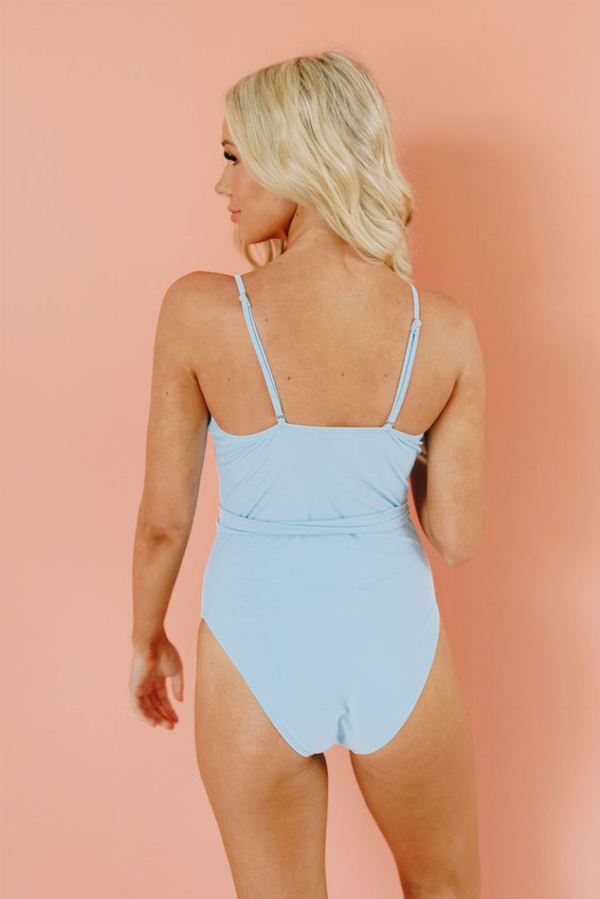 Light blue one-piece swimsuit with spaghetti straps and ruched back