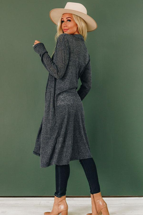 Dark heather knit cardigan with open front and long sleeves, knee-length relaxed fit