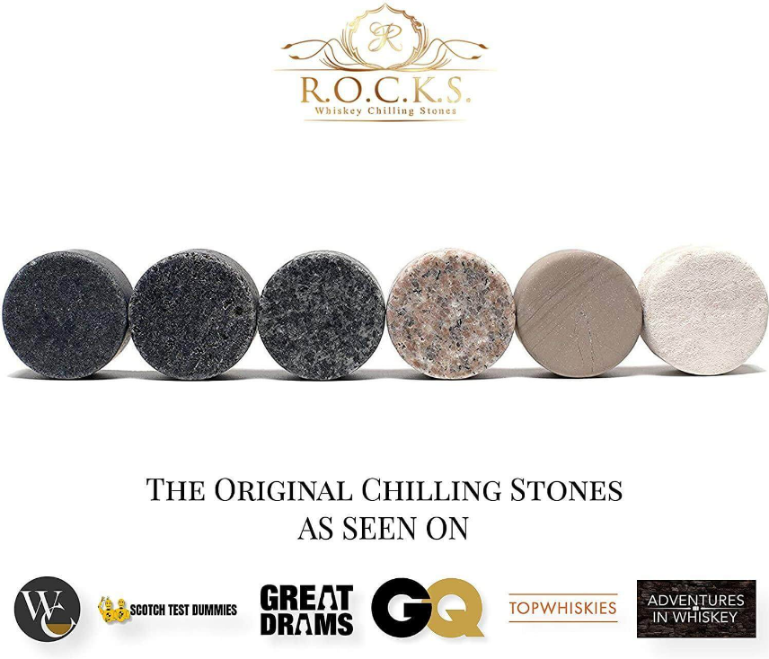 Assorted whiskey chilling stones, six round granite pieces shown in a row