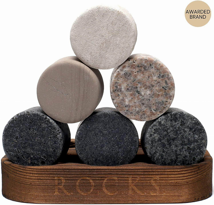 Six whiskey chilling stone spheres on a wooden tray