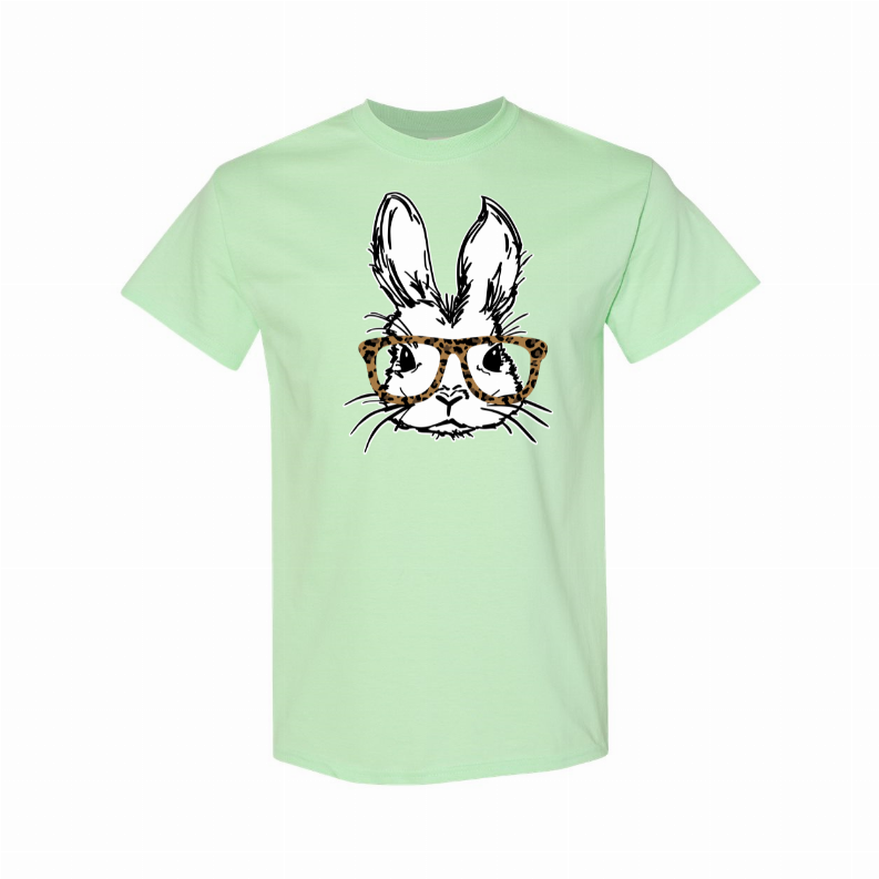 Mint green crewneck T-shirt featuring centered bunny illustration with leopard glasses
