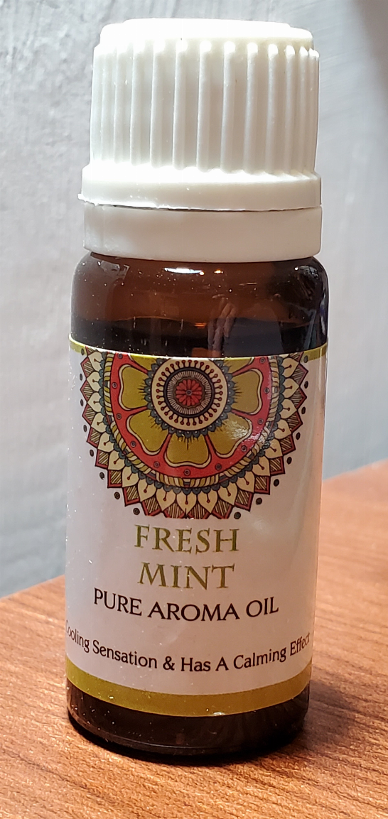 Aromatherapy oil bottle labeled Fresh Mint pure aroma oil with ribbed white cap