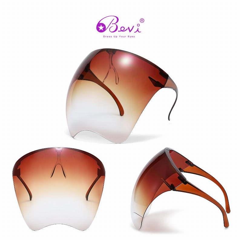 Protective goggles with amber-to-clear mirrored lens and dark flexible frame, side view