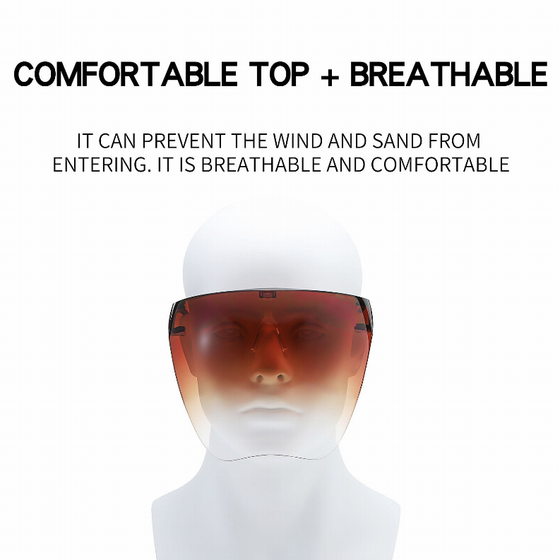 Protective goggles worn on a head with amber lens and transparent protective visor