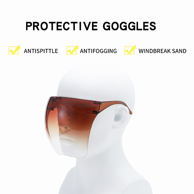 Protective goggles on a mannequin face with amber tinted lens and full coverage shield