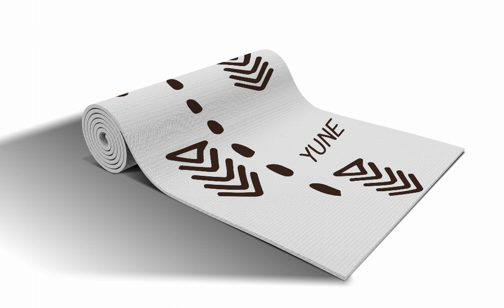 Rolled yoga mat, light gray with dark geometric chevrons and YUNE branding