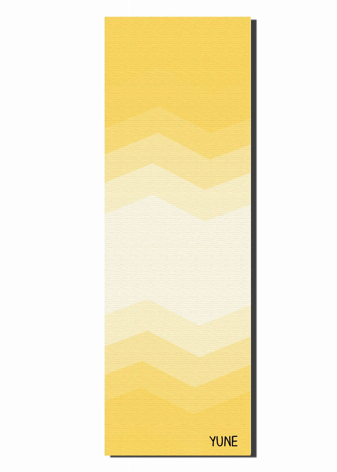 Yoga mat flat with yellow and cream chevron zigzag pattern, YUNE logo at bottom
