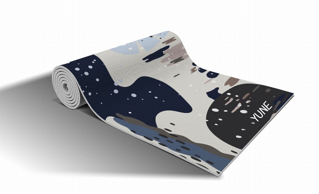 Yoga mat with rolled galaxy-style graphic in navy, beige, and tan
